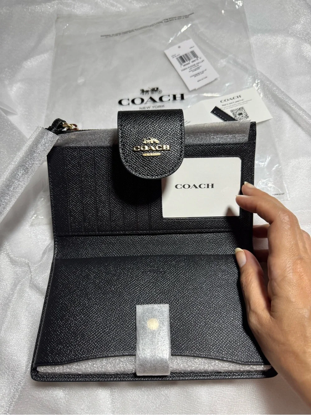 COACH Black Pebbled Leather Phone Wallet with wrist strap, zipped coins pocket